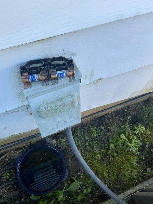 Completed routine cooling maintenance on outdoor air conditioning unit. Inspected electrical connections, disconnect box, and fuses, noting significant accumulation of dirt, dust, and debris within the service panel and around internal components. Verified all electrical connections were secure at terminal blocks, checked disconnect box fuses for proper operation, and confirmed unit operational status per standard maintenance protocol.