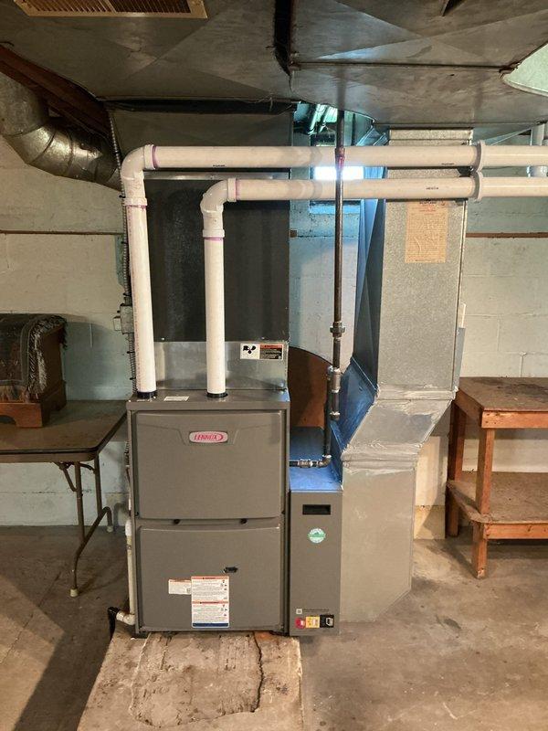 Installed a 96% efficiency 90,000 BTU Merit Series upflow furnace with custom metal spacer fabricated to proper specifications. Replaced 40 feet of 2-inch Schedule 40 PVC piping for both exhaust and intake venting, installed 5-inch filter rack sized for 20x25x5 media filters, and mounted new thermostat for system control.