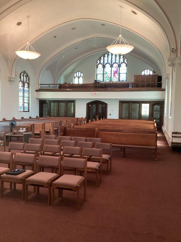 Completed comprehensive site assessment of commercial church sanctuary for mini split HVAC system installation. Documented existing conditions including barrel-vaulted ceiling architecture, elevated choir loft area, and main worship space with wooden pews to determine optimal equipment placement and capacity requirements for climate control of the worship facility.