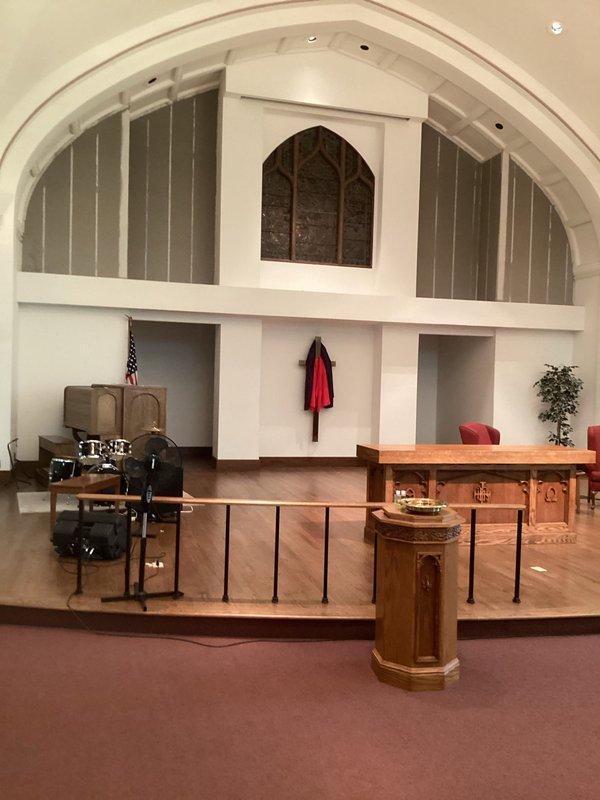 Completed comprehensive site assessment of commercial church sanctuary for mini split HVAC system installation. Documented existing conditions including barrel-vaulted ceiling architecture, elevated choir loft area, and main worship space with wooden pews to determine optimal equipment placement and capacity requirements for climate control of the worship facility.