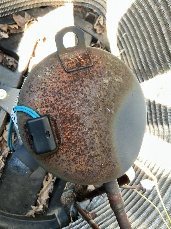 Performed comprehensive cooling system tune-up on 6-7 year old air conditioning unit located in basement area. Completed full system inspection, noting significant rust and corrosion on compressor dome requiring monitoring for future replacement considerations, and assessed ductwork connections showing wear on insulation materials that may need attention to maintain system efficiency.