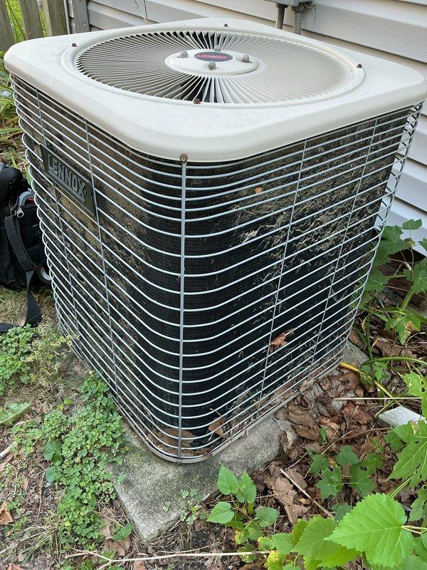 Responded to no cooling complaint on Lennox air conditioning system. Upon arrival, found outdoor condenser unit with heavily soiled condenser coils restricting airflow and preventing proper heat exchange. Cleaned condenser coils, removed accumulated dirt and debris from fins, verified refrigerant lines intact, and restored unit to normal operation with adequate cooling output.