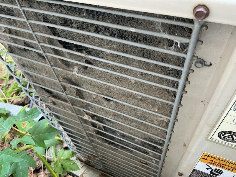 Responded to no cooling complaint on Lennox air conditioning system. Upon arrival, found outdoor condenser unit with heavily soiled condenser coils restricting airflow and preventing proper heat exchange. Cleaned condenser coils, removed accumulated dirt and debris from fins, verified refrigerant lines intact, and restored unit to normal operation with adequate cooling output.
