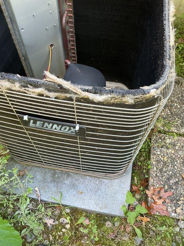 Completed annual maintenance on 21-year-old Lennox air conditioning system. Inspected electrical components including TITAN HD motor run capacitor (model PRCFD405A) and contactor, verifying proper connections and functionality. Cleaned exterior condenser unit, removing significant accumulation of lint, dust, and debris from top grille and surrounding areas. All components tested and operating within normal parameters upon completion.