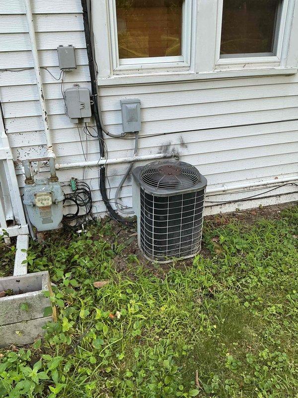 Completed comprehensive cooling system maintenance and tune-up on residential central air conditioning unit. Performed thorough inspection of condenser unit exterior, verified proper clearance from vegetation and obstructions, and accessed electrical compartment to inspect capacitor, wiring connections, and internal components. All electrical connections were examined for proper termination and signs of wear, capacitor tested for proper functionality, and condensate drain line confirmed operational. System evaluated for age-related wear with components showing normal weathering consistent with outdoor installation.