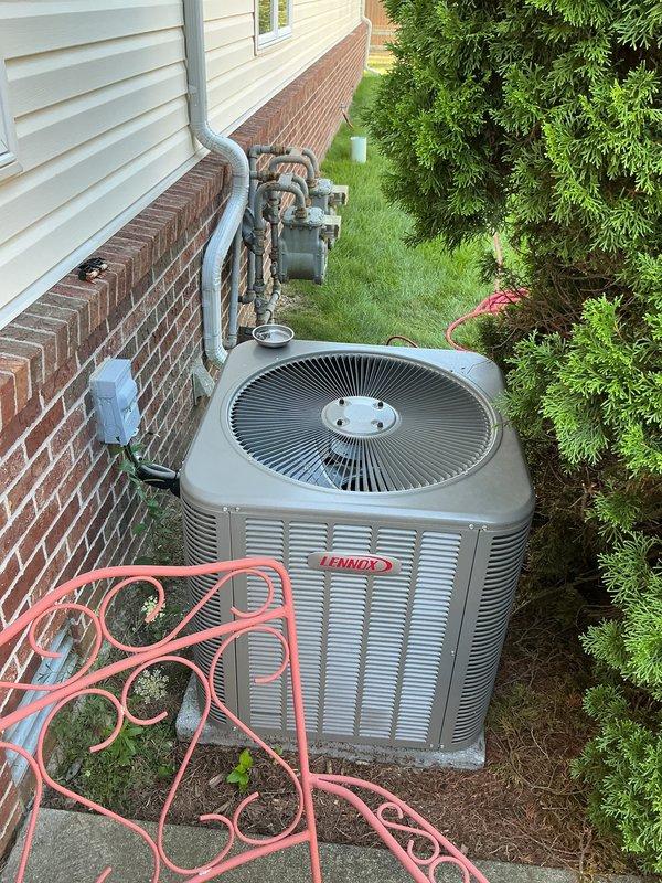 Completed scheduled recurring maintenance visit on 2-year-old Lennox air conditioning system. Performed comprehensive system inspection including outdoor condensing unit, refrigerant line set, electrical disconnect, and all associated components. Verified proper operation of compressor and condenser fan motor. Inspected electrical connections at junction box, confirming secure wire terminations and proper conduit routing. Examined refrigerant lines for insulation integrity and secure mounting along exterior wall. System operating within normal parameters with no deficiencies noted. Unit confirmed operational and ready for continued service.