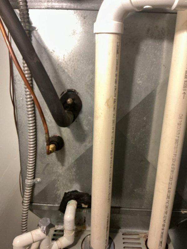 Completed comprehensive tune-up service on 23-year-old HVAC system. Inspected condenser unit exterior components including coils, motor assembly, and refrigerant lines; noted significant accumulation of dirt and debris within unit housing requiring attention during future maintenance. Verified proper mounting and support of associated drainage lines and electrical conduit; all piping connections and wall supports found secure and functional.