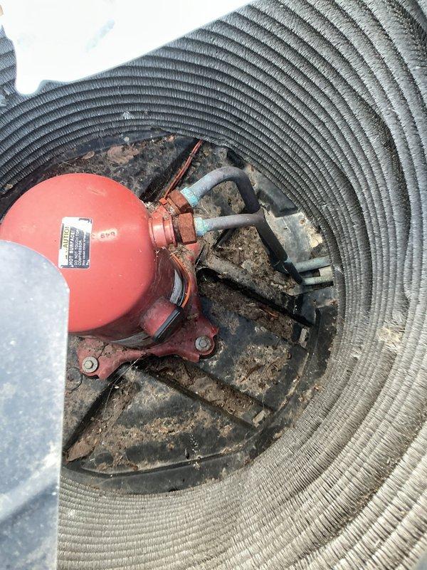 Completed comprehensive tune-up service on 23-year-old HVAC system. Inspected condenser unit exterior components including coils, motor assembly, and refrigerant lines; noted significant accumulation of dirt and debris within unit housing requiring attention during future maintenance. Verified proper mounting and support of associated drainage lines and electrical conduit; all piping connections and wall supports found secure and functional.