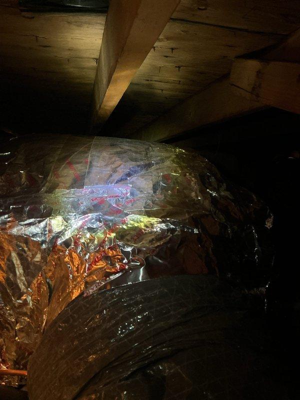 Completed inspection corrections on residential HVAC system. Replaced oversized condenser fuses with proper 20-amp maximum rated fuses to meet code requirements. Installed R6 minimum insulation on return air plenum in crawl space to achieve proper thermal efficiency and comply with building standards.