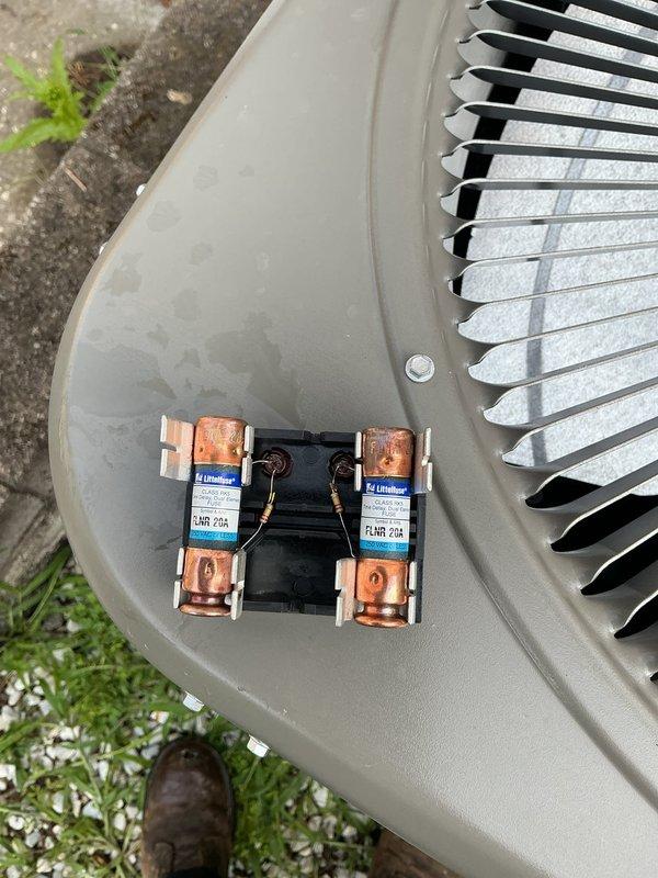 Completed inspection corrections on residential HVAC system. Replaced oversized condenser fuses with proper 20-amp maximum rated fuses to meet code requirements. Installed R6 minimum insulation on return air plenum in crawl space to achieve proper thermal efficiency and comply with building standards.