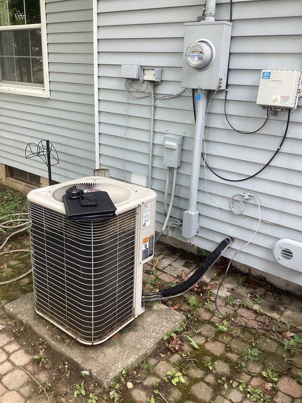 Conducted comprehensive site evaluation for complete HVAC system replacement including furnace and air conditioning equipment. Assessed existing Lennox furnace installation in mechanical room and exterior AC condenser unit mounted on concrete pad with associated electrical disconnect and metering equipment. Documented current system configuration including PVC venting, condensate drainage, electrical service connections, and ductwork connections. Evaluated mechanical room layout with existing water heater and hydronic system components to determine optimal equipment placement and clearance requirements. Inspected exterior condenser location, concrete pad condition, refrigerant line routing, and electrical service adequacy. Photographed all equipment nameplates, specifications, and existing installations to prepare accurate replacement estimate with appropriate equipment sizing and installation requirements.