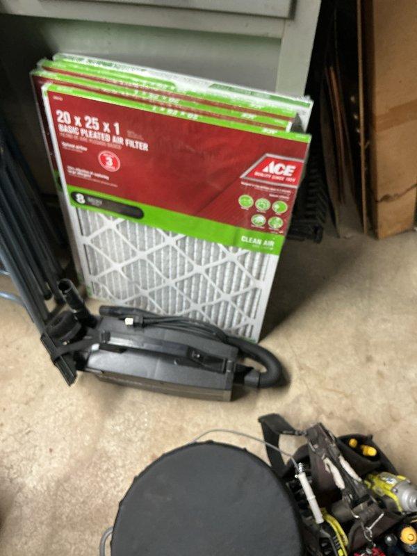 Completed comprehensive A/C tune-up service on residential split system. Inspected outdoor condenser unit, verified proper operation of compressor and condenser fan motor, checked TITAN HD capacitor specifications and electrical connections, and examined condenser coil fins for damage or debris buildup. Noted customer has adequate supply of 20x25x1 pleated air filters on hand for regular maintenance intervals.