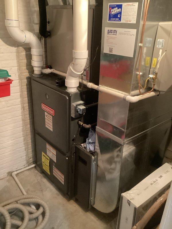 Conducted comprehensive assessment of existing HVAC system for furnace replacement estimate. Evaluated current furnace unit, associated ductwork, PVC ventilation and drainage piping, and refrigerant line connections. Documented equipment specifications, manufacturer information, and system configuration including air handler cabinet and copper line routing. Photographed installation layout, mechanical connections, and surrounding utility space conditions to provide accurate replacement recommendations and ensure proper sizing for new equipment installation.