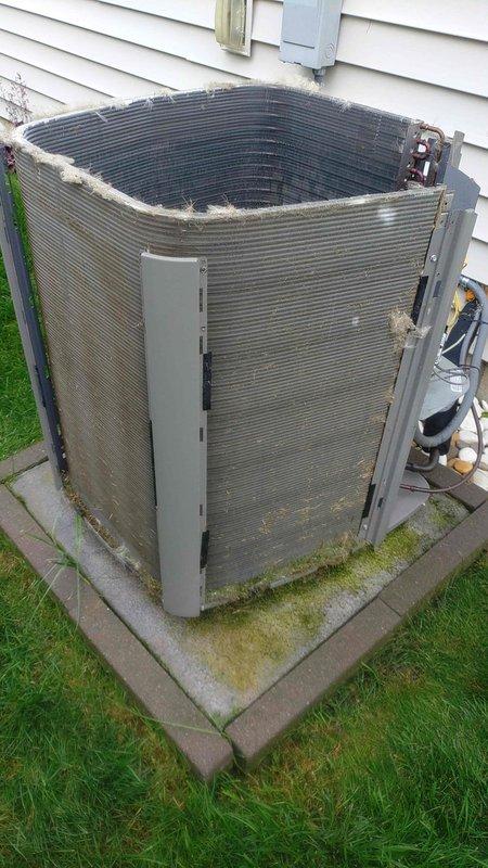 Performed preventative maintenance tune-up on 6-year-old residential air conditioning system. Unit showed signs of environmental wear with dirty condenser coils, accumulated debris, and missing top protective grille exposing fan assembly. Cleaned condenser coils, removed debris from unit exterior, and documented compromised protective grille requiring future replacement to prevent weather damage and ensure safe operation.