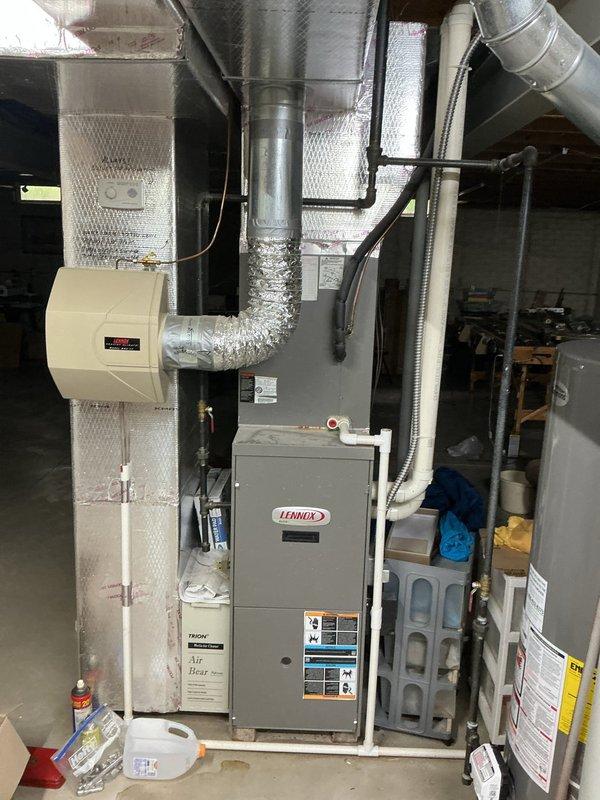 Responded to no-cooling complaint on 20-year-old residential air conditioning system. Upon inspection, determined compressor failure on outdoor condensing unit due to age-related wear and system reaching end of serviceable life. Evaluated indoor air handler and ductwork configuration in basement utility area, confirming proper installation but noting overall system obsolescence. Advised customer that compressor replacement would not be cost-effective given the advanced age of the equipment and recommended full system replacement to restore cooling capacity and improve energy efficiency.