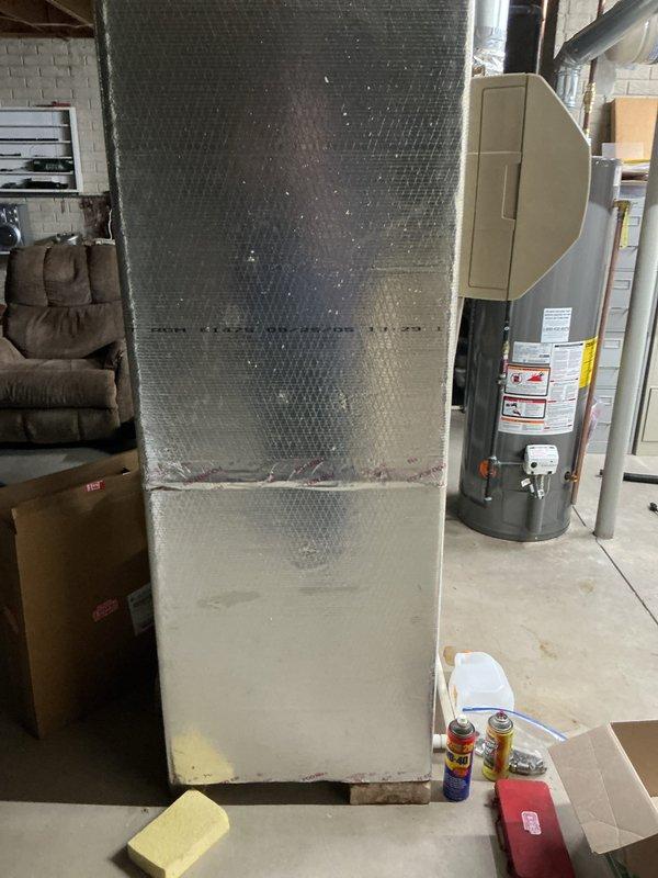 Responded to no-cooling complaint on 20-year-old residential air conditioning system. Upon inspection, determined compressor failure on outdoor condensing unit due to age-related wear and system reaching end of serviceable life. Evaluated indoor air handler and ductwork configuration in basement utility area, confirming proper installation but noting overall system obsolescence. Advised customer that compressor replacement would not be cost-effective given the advanced age of the equipment and recommended full system replacement to restore cooling capacity and improve energy efficiency.