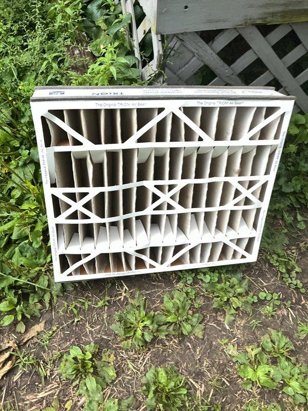 Responded to no-cool complaint on 8-year-old residential air conditioning system with frozen refrigerant lines and no airflow through vents. Upon arrival, confirmed system had been recently charged approximately two months prior, indicating potential refrigerant leak. Discovered severely restricted airflow due to extremely dirty and clogged air filter, which was causing evaporator coil to freeze and preventing proper system operation. Removed and replaced contaminated filter with new unit. System had been shut off by occupant prior to arrival to prevent further damage. Advised that restricted airflow from dirty filter was likely primary cause of freezing condition and may have contributed to refrigerant loss if system had been operating in frozen state for extended period. Recommended monitoring system performance after filter replacement and allowing adequate thaw time before restart to assess whether refrigerant leak is still present or if low airflow was sole cause of freezing issue