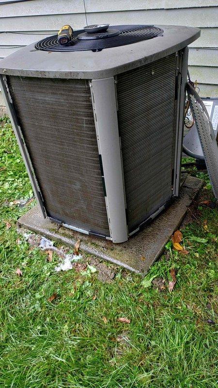 Completed preventive maintenance tune-up on 6-year-old residential air conditioning system. Performed standard diagnostic testing with multimeter, inspected condenser unit operation, and noted significant accumulation of dirt and debris on exterior coil fins requiring cleaning attention. Unit operational at time of service completion.