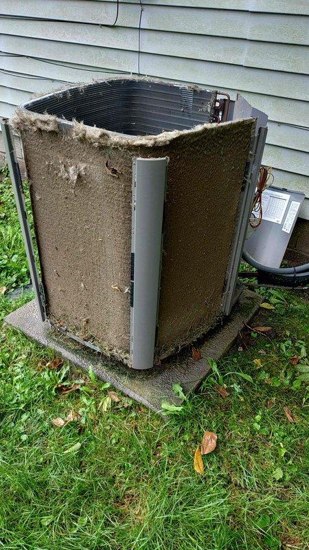 Completed preventive maintenance tune-up on 6-year-old residential air conditioning system. Performed standard diagnostic testing with multimeter, inspected condenser unit operation, and noted significant accumulation of dirt and debris on exterior coil fins requiring cleaning attention. Unit operational at time of service completion.