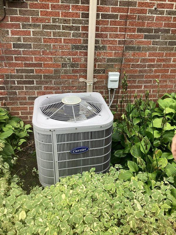 Completed comprehensive estimate for full HVAC system replacement at residential property. Evaluated existing Carrier outdoor condensing unit located against exterior brick wall and attic-mounted air handler with associated ductwork and plenum components. Documented current equipment conditions, measurements, and installation requirements through photographic assessment to provide customer with replacement options and specifications for new heating and cooling system.