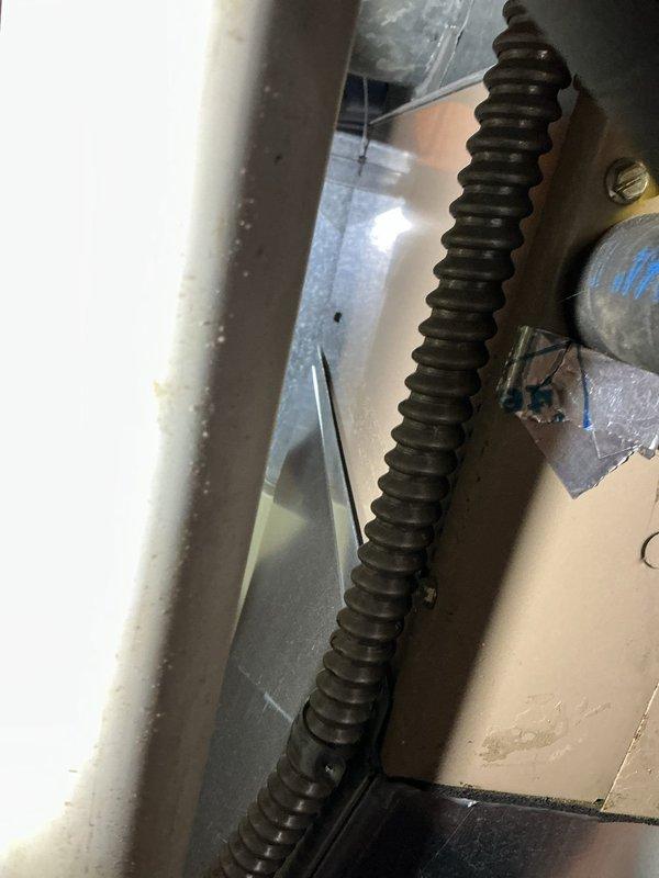Responded to service call for condensation issue at customer vent location. Upon investigation, discovered significant moisture accumulation requiring exploratory access through ceiling material to identify source. Found evidence of condensate drainage concerns with visible water damage to surrounding surfaces and corrosion on copper piping components, indicating prolonged exposure to moisture conditions that required immediate attention and remediation.