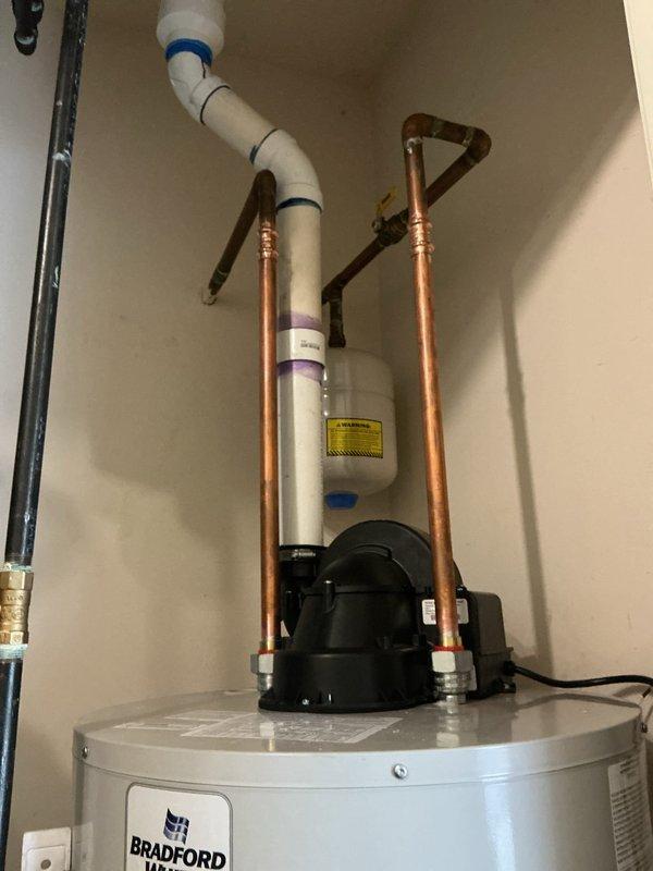 Completed full HVAC system installation including a 50-gallon Bradford White power vent water heater with recirculation pump. All copper and PVC plumbing connections were professionally installed with proper mounting brackets, pressure relief valve, and venting system secured according to manufacturer specifications.