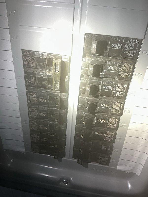 Responded to no-cooling complaint on 9-year-old Ducane 3-ton central A/C unit, Model 4AC13L36P-11A. Replaced blown 25A condenser fuse and restored power to outdoor unit. Upon startup attempt, observed house lights flickering and dimming, indicating excessive current draw, with unit still failing to cool. Diagnosed compressor locked rotor or internal electrical fault causing high amperage draw and preventing normal operation. Recommended compressor replacement or full condenser unit replacement due to age and repair costs.