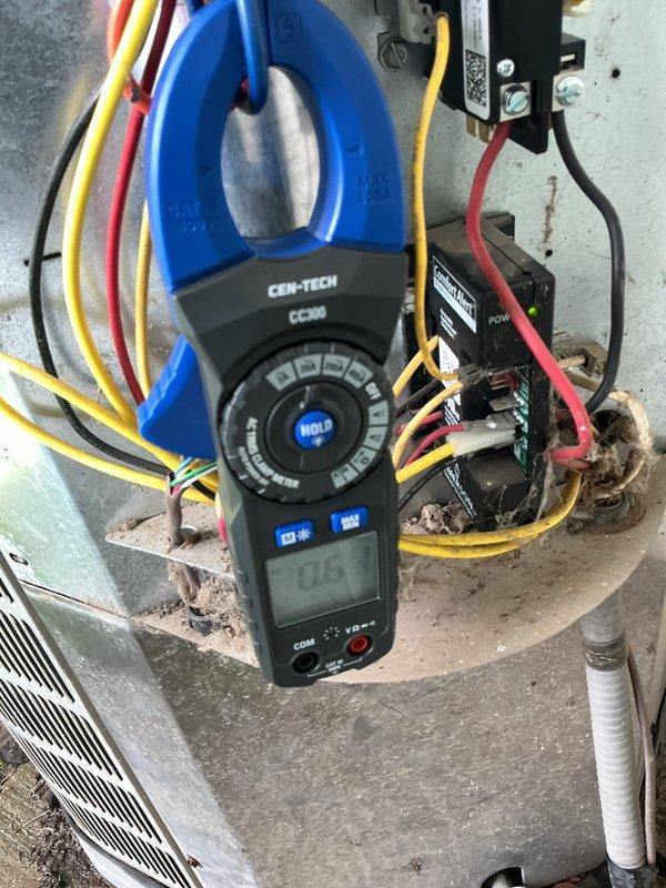Responded to no-cooling call on 16-year-old central air conditioning system. Upon arrival, confirmed outdoor condenser unit was not energizing when thermostat called for cooling, while indoor blower operated normally. Performed electrical diagnostics at outdoor unit using clamp meter to test voltage and amperage at contactor and control circuits. Found contactor coil failed to energize due to loss of 24V control signal. Cleaned accumulated debris and cobwebs from electrical components. Tested and verified proper voltage at disconnect, confirmed capacitor readings within specification, and checked all wire connections for integrity. Replaced defective contactor, restored power, and cycled system through multiple cooling calls to verify proper operation. Unit now engaging on demand with normal compressor amperage draw and adequate airflow across condenser coil.