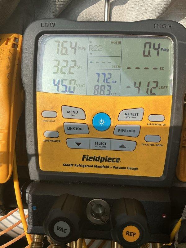 # HVAC Tune-Up Completed

Performed comprehensive tune-up on 25-year-old ground-level air conditioning unit. Connected refrigerant manifold gauge set and recorded system pressures and temperatures, verifying proper refrigerant charge and system operation. Inspected electrical connections at contactor and terminal block, confirming all wire terminations were secure and properly insulated with heat shrink tubing where appropriate.