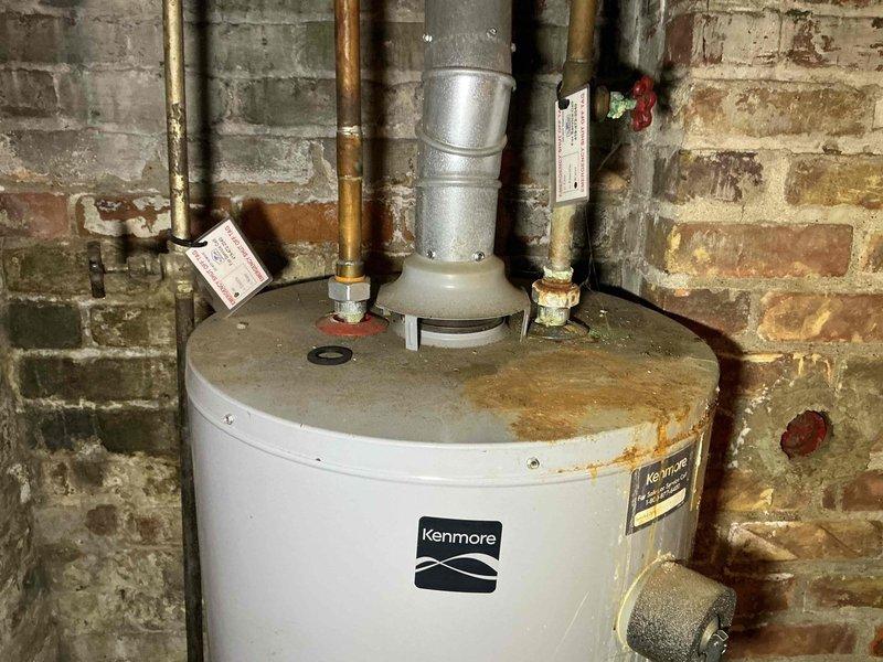 Completed scheduled maintenance on a 5-year-old gas-powered Kenmore water heater. Performed visual inspection of unit, verified proper operation of all controls and safety devices, and checked pipe connections and venting system for integrity. All components found to be functioning within normal parameters, with minor age-appropriate wear noted on copper piping and unit exterior.