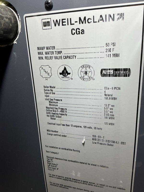 Performed annual maintenance on a 28-year-old Weil-McLain CGa-6 PIDM natural gas-fired boiler. Inspected unit specifications confirming 50 PSI MAWP, 250°F maximum water temperature, and proper relief valve capacity rating. During inspection, discovered severely corroded galvanized piping with extensive rust deterioration at threaded connections and elbow joints, requiring immediate attention to prevent system failure and potential water damage.