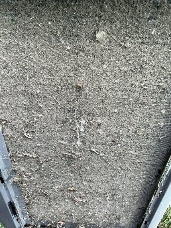Responded to service call for 12-year-old air conditioning system not cooling properly. Upon inspection, found heavily soiled condenser coil with significant dirt and debris accumulation restricting airflow, along with damaged fins throughout the heat exchanger. Cleaned condenser coil, straightened bent fins, and verified proper system operation with unit cycling correctly and producing cold air.