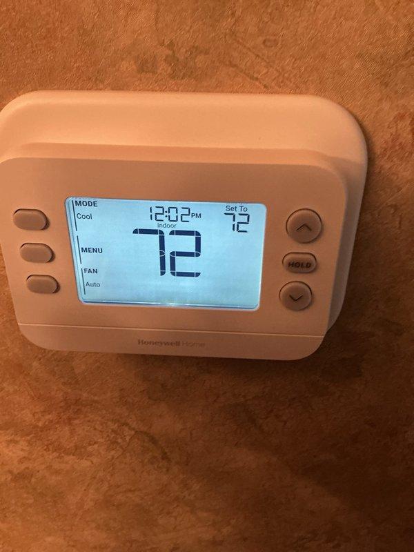 Responded to service call for non-functioning thermostat that was previously installed. Upon arrival, verified Honeywell Home digital thermostat was powered on and displaying properly with current temperature reading of 72°F and system set to cooling mode at 73°F setpoint. Confirmed thermostat was operating correctly with display showing proper time, temperature readings, and system status indicating "Indoor Following Schedule" with fan set to auto mode. Unit tested successfully and left in working condition.