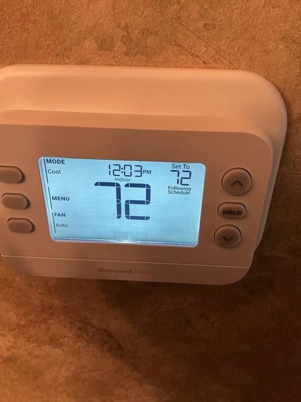 Responded to service call for non-functioning thermostat that was previously installed. Upon arrival, verified Honeywell Home digital thermostat was powered on and displaying properly with current temperature reading of 72°F and system set to cooling mode at 73°F setpoint. Confirmed thermostat was operating correctly with display showing proper time, temperature readings, and system status indicating "Indoor Following Schedule" with fan set to auto mode. Unit tested successfully and left in working condition.