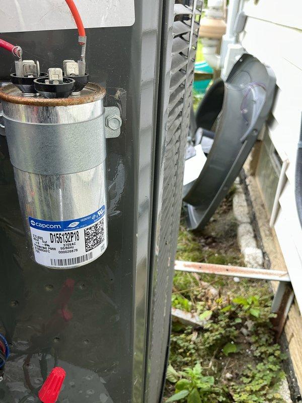 Responded to no cooling complaint on 120 SCAC unit. Upon inspection, found failed capacitor with visible rust and corrosion at base, along with heavily contaminated evaporator coil restricting airflow. Replaced defective capacitor and cleaned evaporator coil to restore proper system operation and cooling performance.