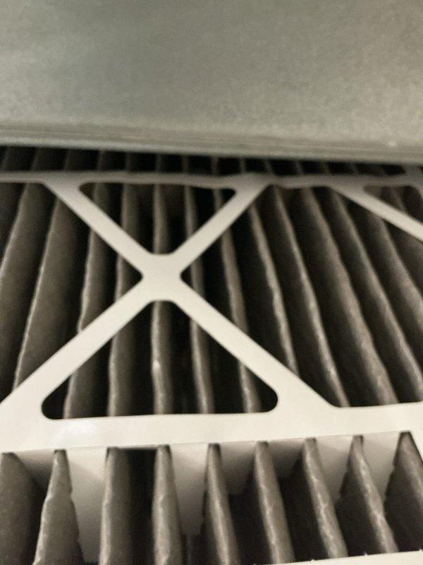 Completed comprehensive HVAC system tune-up including full system inspection and filter evaluation. Inspected water heater utility connections, gas line installation, and associated plumbing components to ensure proper clearances and safe operation of mechanical systems. Verified air filter condition in return air housing, confirmed proper installation and adequate airflow through pleated media filtration system.