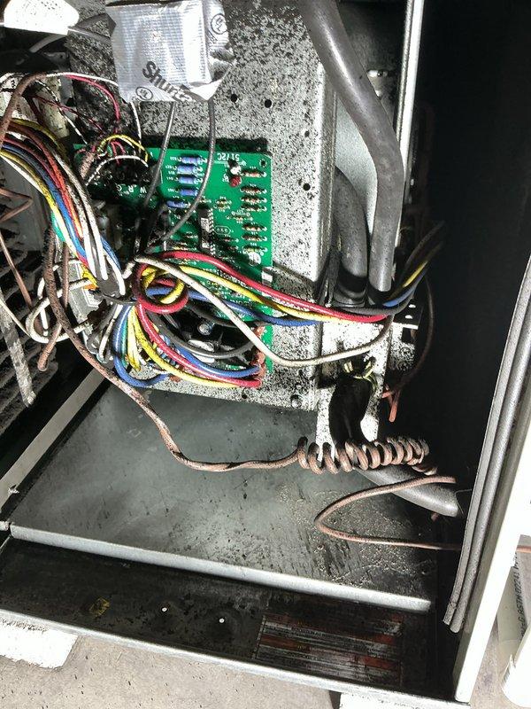 Responded to service call for furnace assessment following basement fire incident. Performed comprehensive visual inspection of furnace cabinet, internal components, electrical control board, wiring harnesses, and blower assembly. Utilized multimeter to test electrical circuits and verify system integrity. Removed access panels to examine interior compartment for fire damage, heat exposure, soot contamination, and compromised components. Inspected control board for signs of thermal damage, melted connections, or electrical shorting. Evaluated blower motor, wiring bundles, copper refrigerant lines, and condensate drain system for structural damage. Documented equipment condition with photographs showing internal components, electrical connections, and overall unit status to provide customer with detailed assessment for repair versus replacement decision.