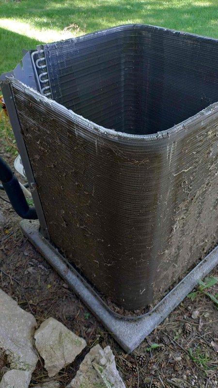 Completed comprehensive tune-up service on a 2-year-old residential air conditioning system. Upon arrival, found exterior condenser unit heavily soiled with accumulated dirt, debris, and organic matter significantly restricting airflow through coil fins. Performed thorough coil cleaning to restore proper heat transfer efficiency and system performance, ensuring optimal operation for the cooling season.