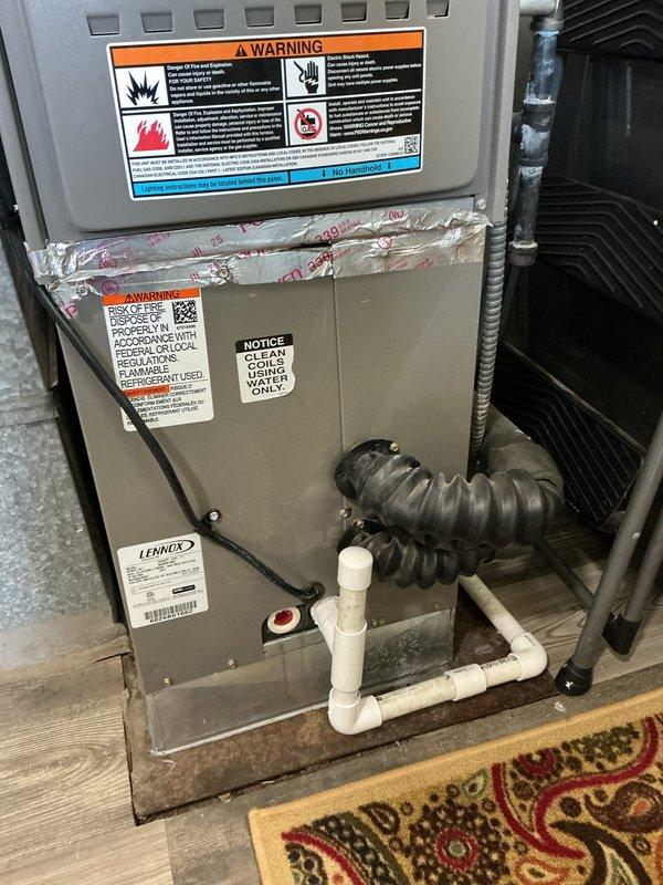 Responded to service call for condensate leak on recently installed Lennox HVAC system. Upon inspection, identified improper drainage from condensate line causing water leakage. Verified furnace and air conditioning unit were functioning properly otherwise. Corrected PVC condensate piping configuration to ensure proper drainage and prevent future leaks. System tested and confirmed operational with no further water discharge issues.