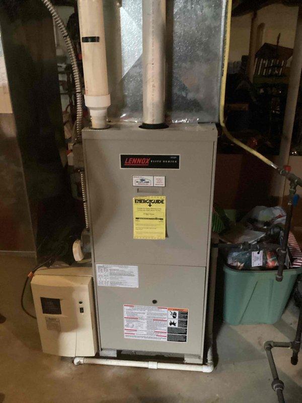 Conducted comprehensive evaluation of existing Lennox furnace and water heater system in basement mechanical room to provide replacement estimate. Assessed current HVAC infrastructure including ductwork configuration, PVC venting system, copper plumbing connections, and electrical connections to determine replacement specifications and installation requirements for both heating appliance and domestic water heating equipment.