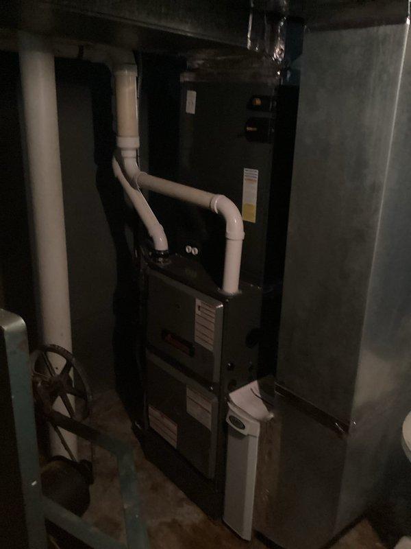Completed comprehensive site evaluation for HVAC system replacement, including assessment of existing furnace/air handler unit and electrical infrastructure. Documented current equipment configuration, electrical panel capacity with main breaker and circuit layout, and existing PVC condensate drainage system. Provided detailed estimate for complete air conditioning system replacement and installation of ductless mini-split units to enhance climate control efficiency and zoning capabilities throughout the property.