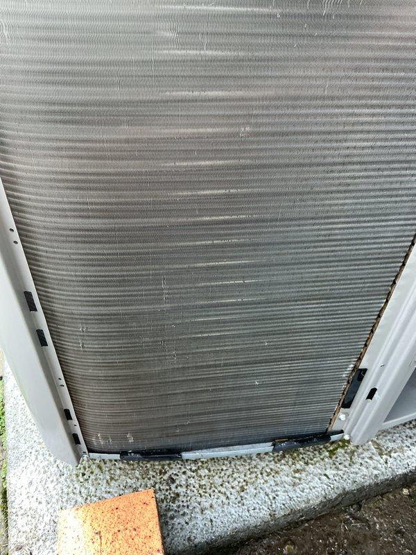 Completed routine AC tune-up on 6-year-old outdoor condensing unit. Performed electrical diagnostics using clamp meter to verify proper amperage draw and system operation. Inspected condenser coil which showed moderate accumulation of dirt, dust, and debris between fins; noted discoloration and particulate buildup requiring cleaning to maintain optimal heat transfer efficiency and system performance.