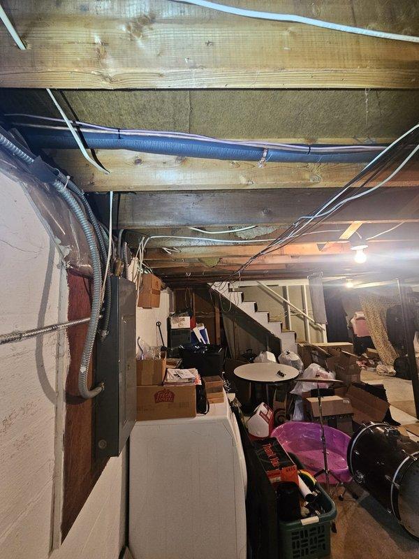 Responded to callback for line set insulation repair in basement area above ductwork. Located exposed refrigerant line set running horizontally along ceiling joists where insulation had become damaged or displaced. Removed deteriorated insulation sections and installed new foam insulation over copper refrigerant lines to prevent condensation and maintain system efficiency. Secured insulation properly with appropriate fasteners and verified complete coverage of line set from air handler connection point through basement ceiling area. Documented completed repairs with photos showing proper insulation installation and routing alongside existing ductwork and mechanical systems.