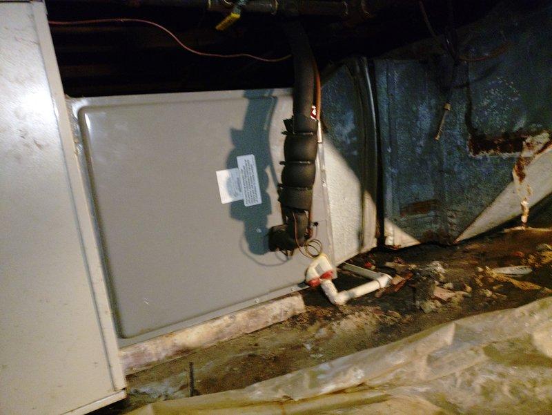 Completed comprehensive AC tune-up on 8-year-old split system with outdoor condensing unit and indoor air handler located in crawl space. Performed standard maintenance protocol including filter inspection, electrical connections check, refrigerant line assessment, and verification of proper system operation. Noted moisture-related deterioration on crawl space floor and minor corrosion on equipment base, though unit remains operational within normal parameters.