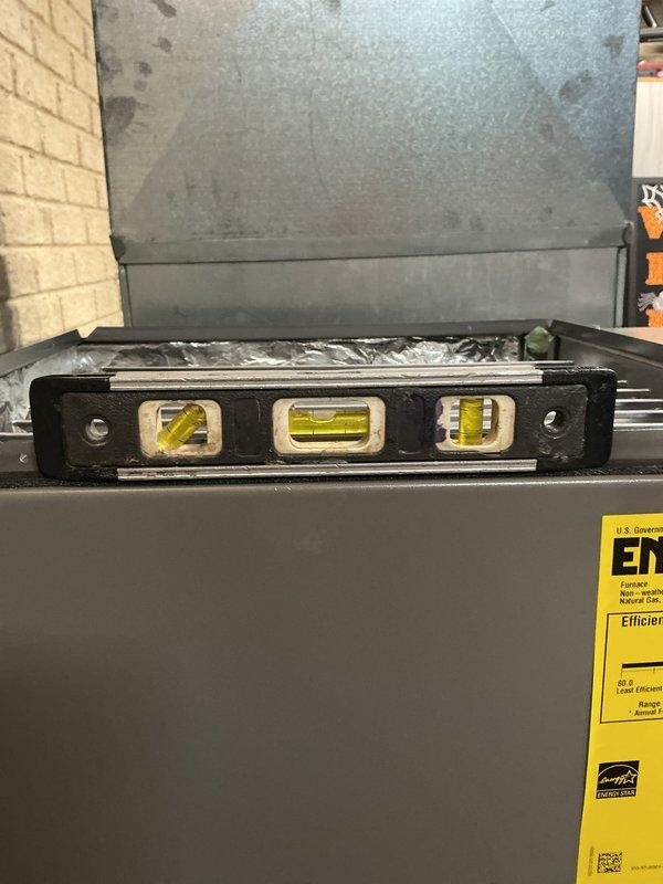 Completed full HVAC system replacement due to existing condenser failure with burnt components. Inspected electrical feed to disconnect for damaged wiring and installed new #10 AWG circuit as required. Installed Lennox 96% AFUE 90,000 BTU two-stage variable speed upflow furnace with approximately 40 feet of new 2-inch PVC exhaust and intake venting. Installed Lennox upflow cased evaporator coil, metal 5-inch filter rack, and 17-gallon whole-home humidifier. Replaced outdoor unit with 17 SEER two-stage condenser on new equipment pad, brought stone and leveled pad to sidewalk. Ran new 3/4-inch x 12-foot refrigerant lineset and installed new programmable thermostat. Verified system operation, proper airflow, and confirmed AHRI certification match for optimal efficiency and performance.