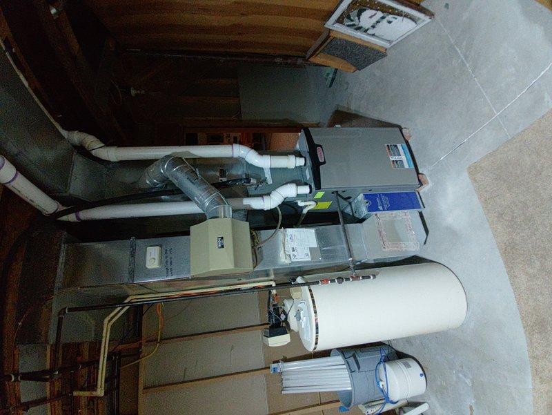 Completed comprehensive tune-up service on residential HVAC system including both air conditioning and furnace units located in basement mechanical room. Performed standard maintenance procedures, inspected air handler, ductwork connections, PVC drain lines, and all mechanical components to ensure proper operation and system efficiency for the upcoming season.