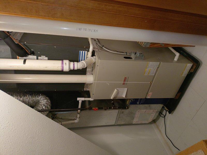 Completed comprehensive tune-up service on residential HVAC system including both air conditioning and furnace units located in basement mechanical room. Performed standard maintenance procedures, inspected air handler, ductwork connections, PVC drain lines, and all mechanical components to ensure proper operation and system efficiency for the upcoming season.