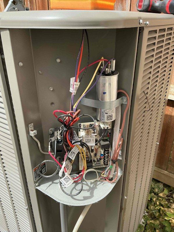 Completed comprehensive maintenance inspection on 2-year-old residential air conditioning system. Performed visual examination of outdoor condensing unit, verified proper electrical connections at capacitor and control board, and inspected refrigerant line connections running to indoor unit. All components operating within normal parameters with no deficiencies noted.