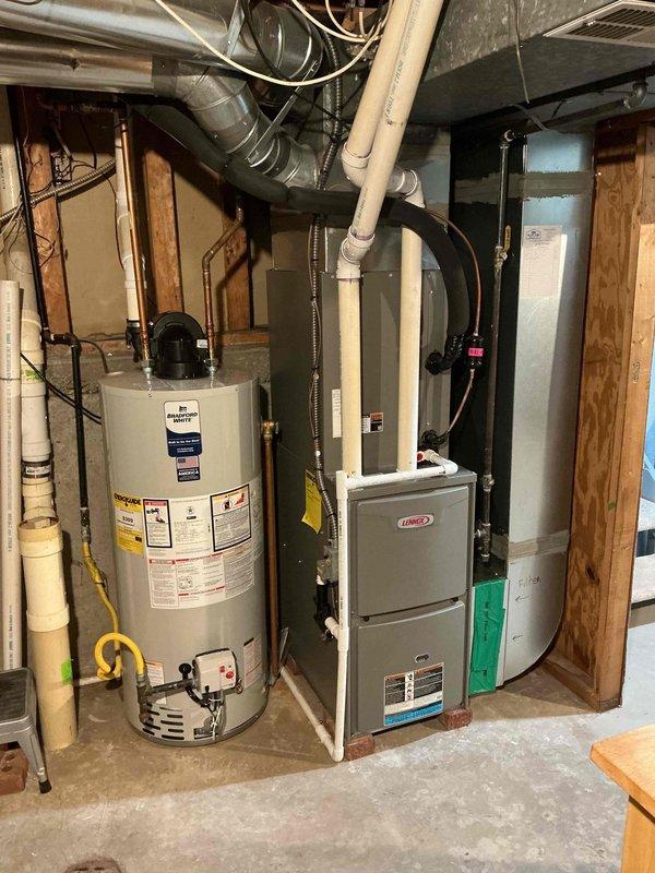 Completed comprehensive tune-up service on residential Lennox furnace system and air conditioning unit. Performed combustion analysis using Testo 310 II analyzer, confirming optimal furnace performance with efficiency reading of 94.6%, stack temperature of 103.2°F, oxygen level at 6.0%, and carbon monoxide at 28 ppm—all within manufacturer specifications for natural gas operation. Inspected basement mechanical room equipment including HVAC system, associated ductwork, electrical connections, gas piping, and condensate drainage. Verified proper operation of all system components, confirmed adequate airflow through supply and return ductwork, and ensured all safety controls functioning correctly. System operating efficiently with no deficiencies noted.