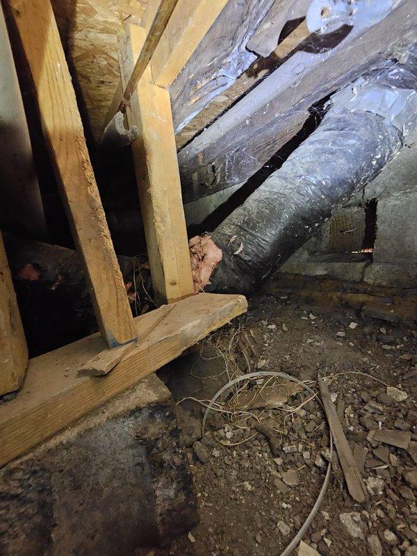 Responded to service call for ductwork repair in crawl space. Upon inspection, found deteriorated flexible ductwork with visible age-related damage, dust accumulation, and compromised insulation integrity. Successfully accessed confined crawl space area, assessed existing duct conditions, and completed necessary repairs to restore proper HVAC airflow and system efficiency.
